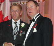 Bradford McIntyre & Dr. Colin Carrie - Bradford McIntyre receives the Queen Elizabeth II Diamond Jubilee Medal for excellence in the field of HIV/AIDS in Canada, on November 27, 2012.