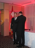 Bradford McIntyre presented with the Queen Elizabeth II Diamond Jubilee Medal and Medal pinned by Dr. Colin Carrie, Parliamentary Secretary to the Minister of Health. November 27, 2012.