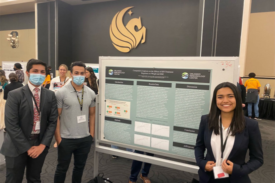Undergraduate students, (left to right) Parth Chandan, Brandon Cohen and Daniela Castro, presenting their poster at the Florida Undergraduate Research Conference earlier this year.