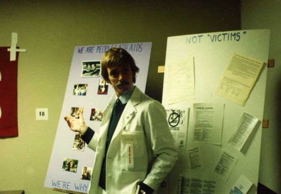 BOBBI CAMPBELL EXHIBITS INFORMATION AT THE CLINICAL NURSING CONFERENCE ON AIDS AT NIH, OCTOBER 7, 1983. PHOTO SOURCED FROM BOBBI CAMPBELLS DIARY, VIA UC SAN FRANCISCO LIBRARY, SPECIAL COLLECTIONS.
