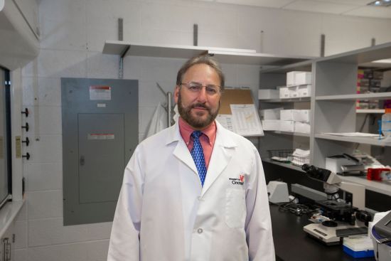 Carl Fichtenbaum, MD, in his lab on the medical campus. Photo/University of Cincinnati.