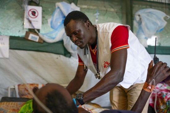 Dr. Isaac Batali examines a patient in the inpatient department at MSF's hospital in Lankien, Jonglei state. | South Sudan 2022 � Paul Odongo/MSF