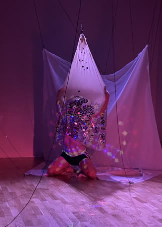 In his new work, Red Tethers, Atlanta artist Jimmy Joyner uses fabric and disco ball mirrors to create a mood.