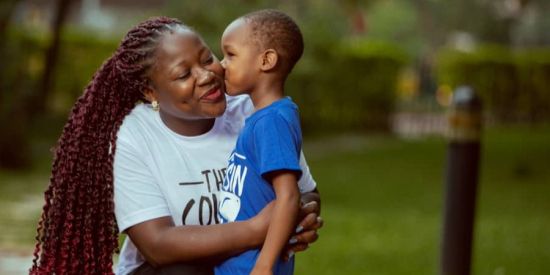 Robinah Babirye with her son in Uganda. Photo credit: Robinah Babirye