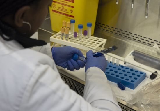 Labelling samples at Aurum Institute Rustenberg, South Africa. Photo credit: Mwangi Kirubi