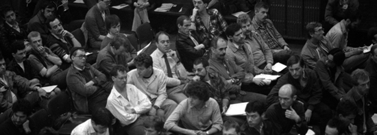 Photo shows people at the first public meeting of what became the Terrence Higgins Trust in London in 1983. Copyright: Terrence Higgins Trust.